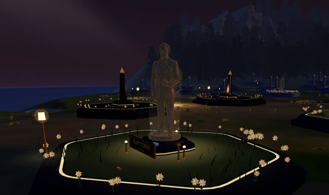 Turing's tribute plot in the Vale at golden hour: the statue over its garden, the lamps just lit